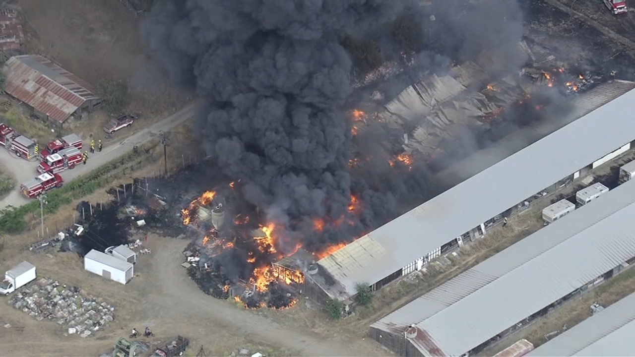 Source-feed image associated with Firefighters battling 5‑acre brush and structure fire in Livermore