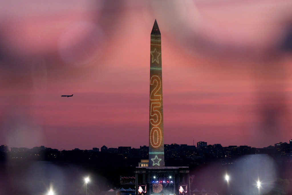 Source-feed image associated with Americans step out for their nation's 250th in a proud moment sown with division and doubt