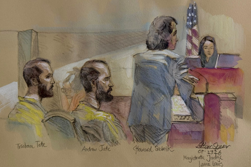Source-feed image associated with Tate brothers appear in court, asking to be released from jail during extradition fight