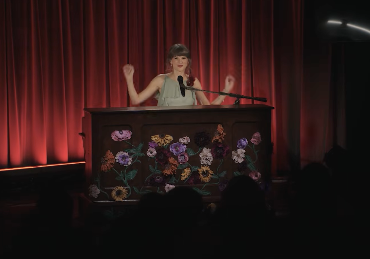 Source-feed image associated with Taylor Swift Sings Mashup of ‘All Too Well,’ ‘I Knew It, I Knew You’ and ‘August’ in Grammy Museum Video