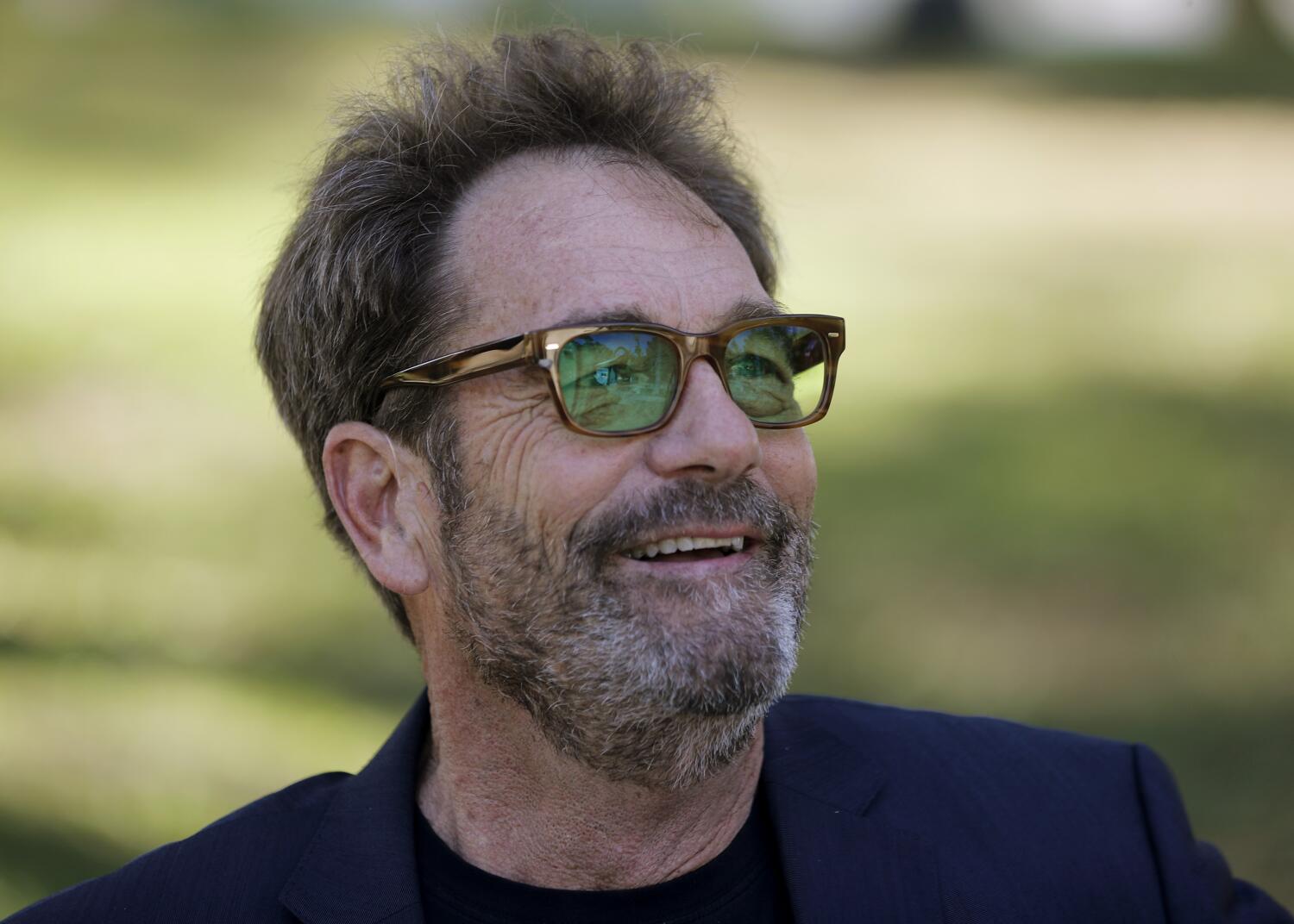 Source-feed image associated with Huey Lewis details how he 'can't enjoy music' anymore because he is 'basically deaf'