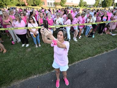 Source-feed image associated with Women in pink rally in support of Lindsay Clancy who is on trial for killing 3 children