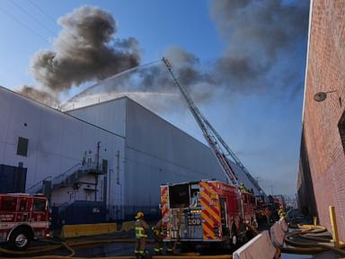 Source-feed image associated with Los Angeles warehouse fire prompts shelter-in-place orders due to hazardous air