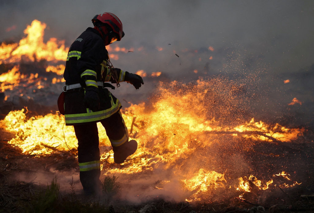 Source-feed image associated with Firefighters race to control massive blazes approaching major cities in France and Spain