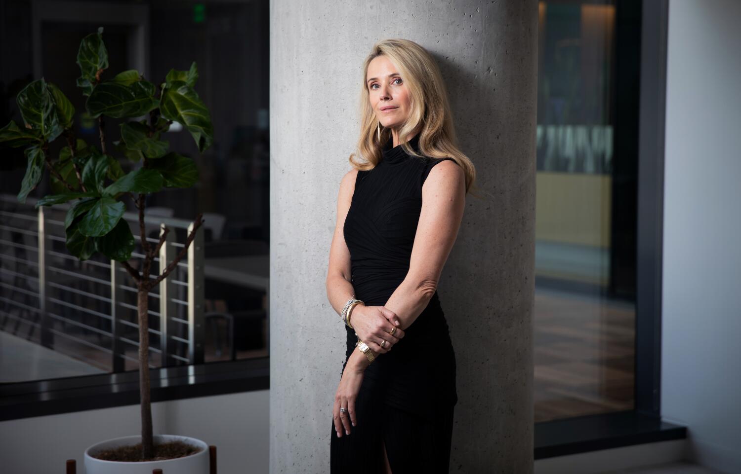 Source-feed image associated with California's 'first partner' targeted by Trump, Newsom says. Here is what we know about her career, finances