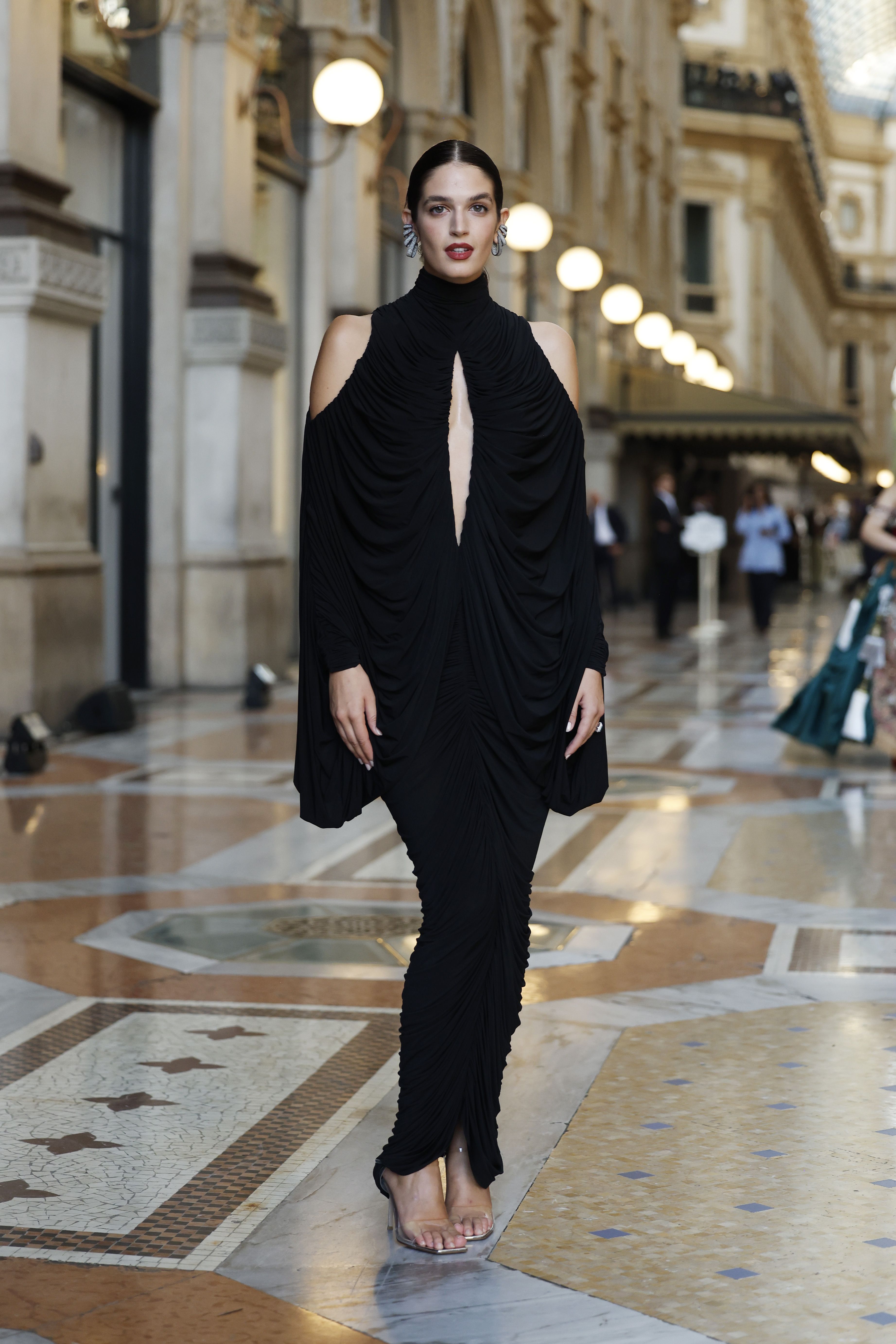 Image from linked report: Vogue World Milan 2026 Red Carpet: Jennifer Lopez, Naomi Campbell, Dakota Johnson, Pamela Anderson (Updating Live)