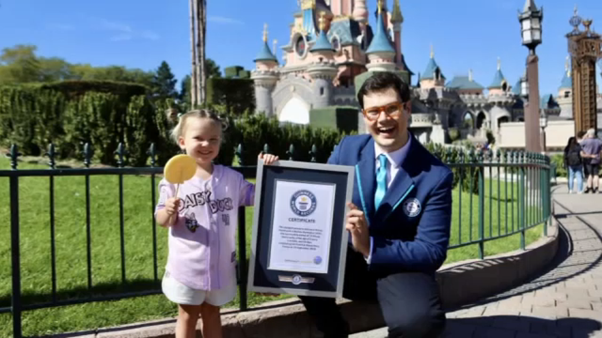 Source-feed image associated with 3-year-old becomes youngest person to visit all 12 Disney parks across globe, Guinness World Records announces