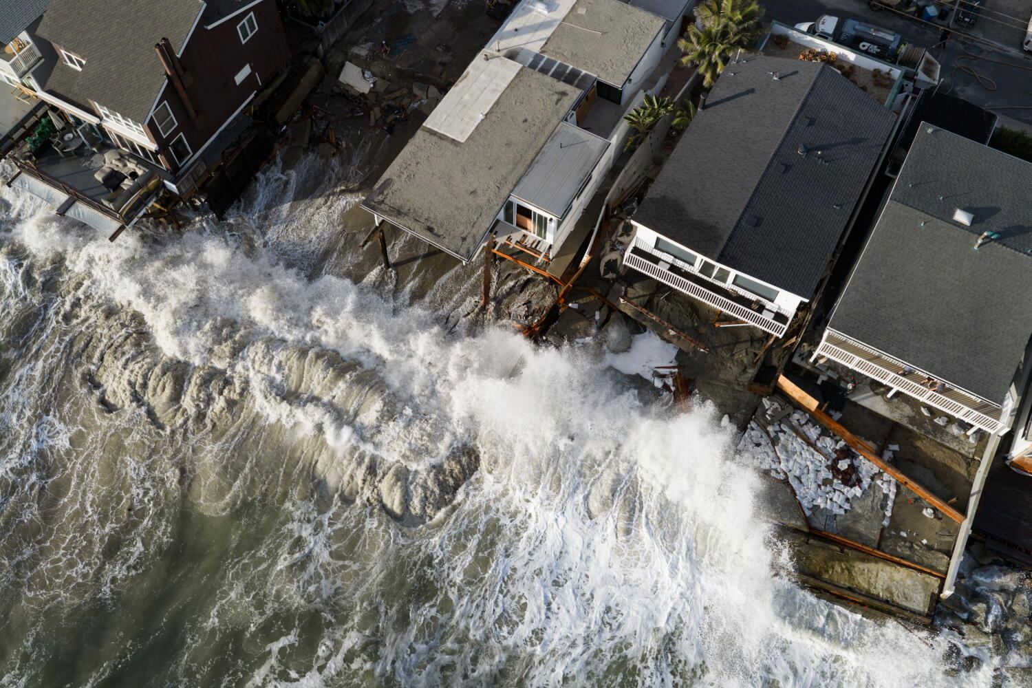 Source-feed image associated with 'The whole beach is gone': Big waves, flooding bring destruction to SoCal coast. It's a warning