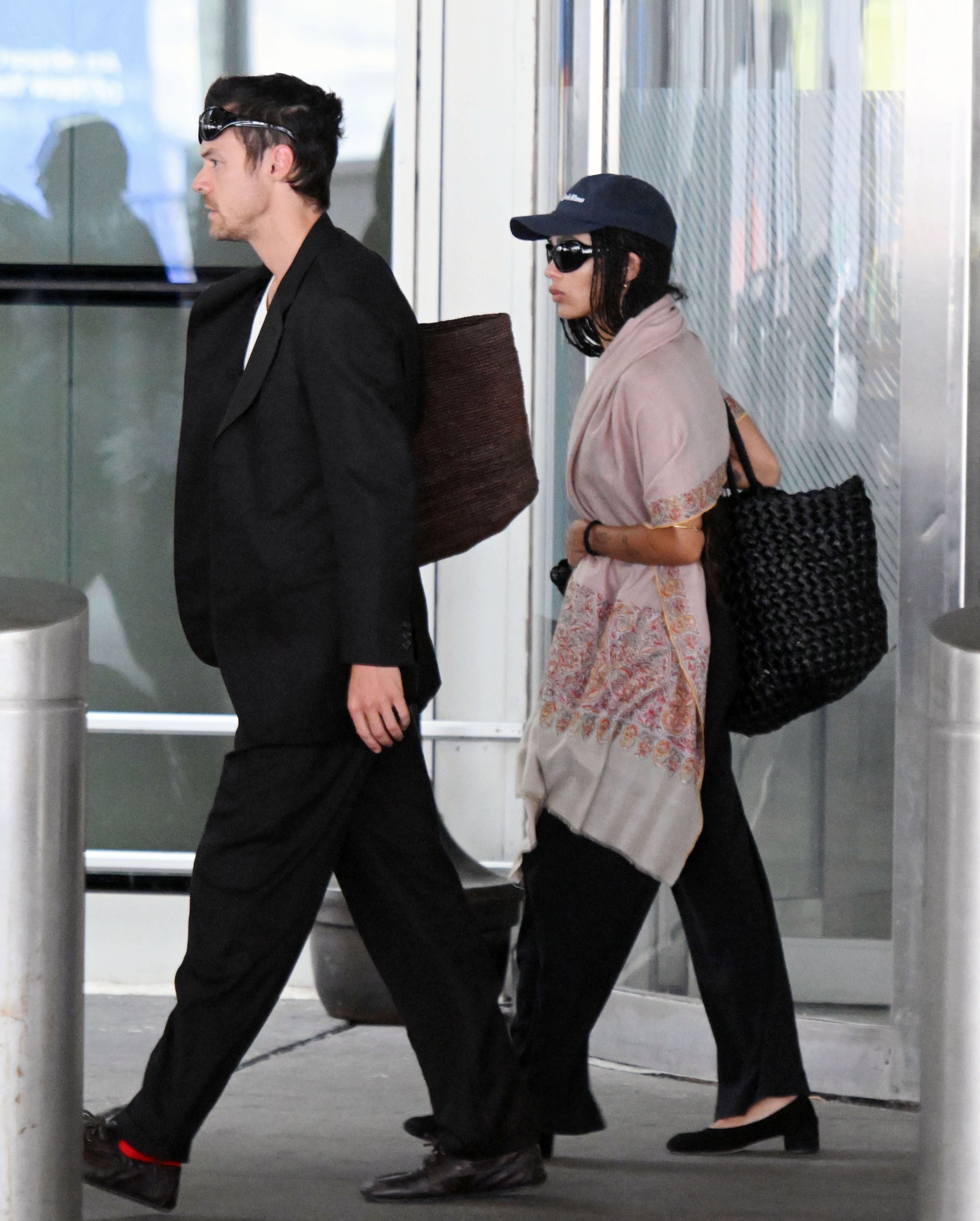 Source-feed image associated with Harry Styles and Zoë Kravitz Propose Different Approaches to the Travel Outfit