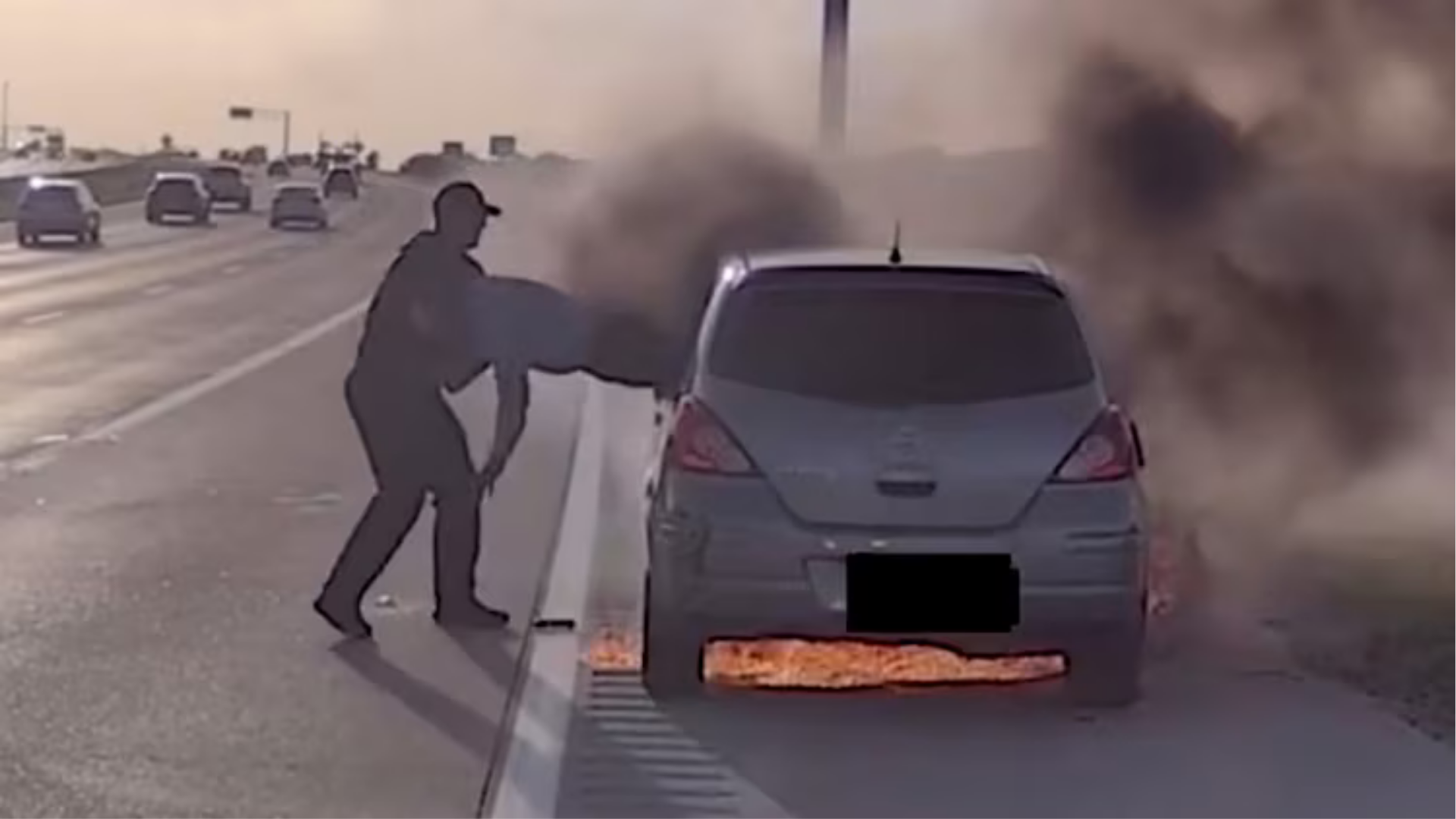 Source-feed image associated with Officer speaks out after rescuing driver trapped in burning car