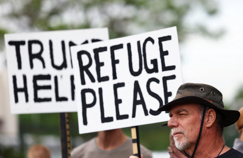 Source-feed image associated with 3 things to know about Trump's order raising the U.S. refugee cap only for white South Africans