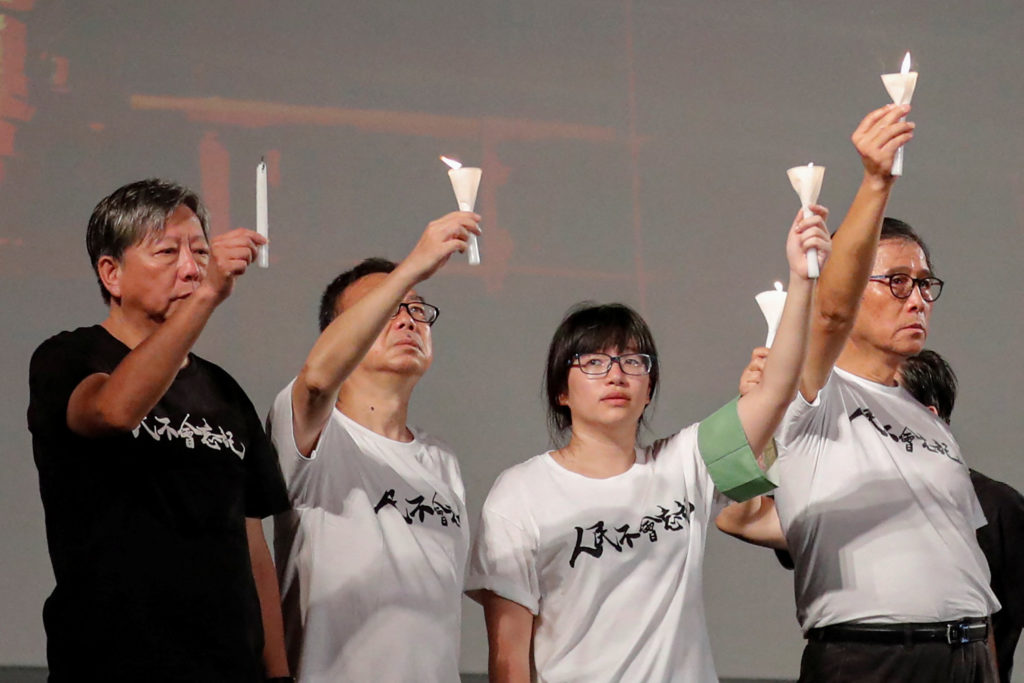 Source-feed image associated with 2 organizers of Hong Kong's Tiananmen vigils convicted in national security case