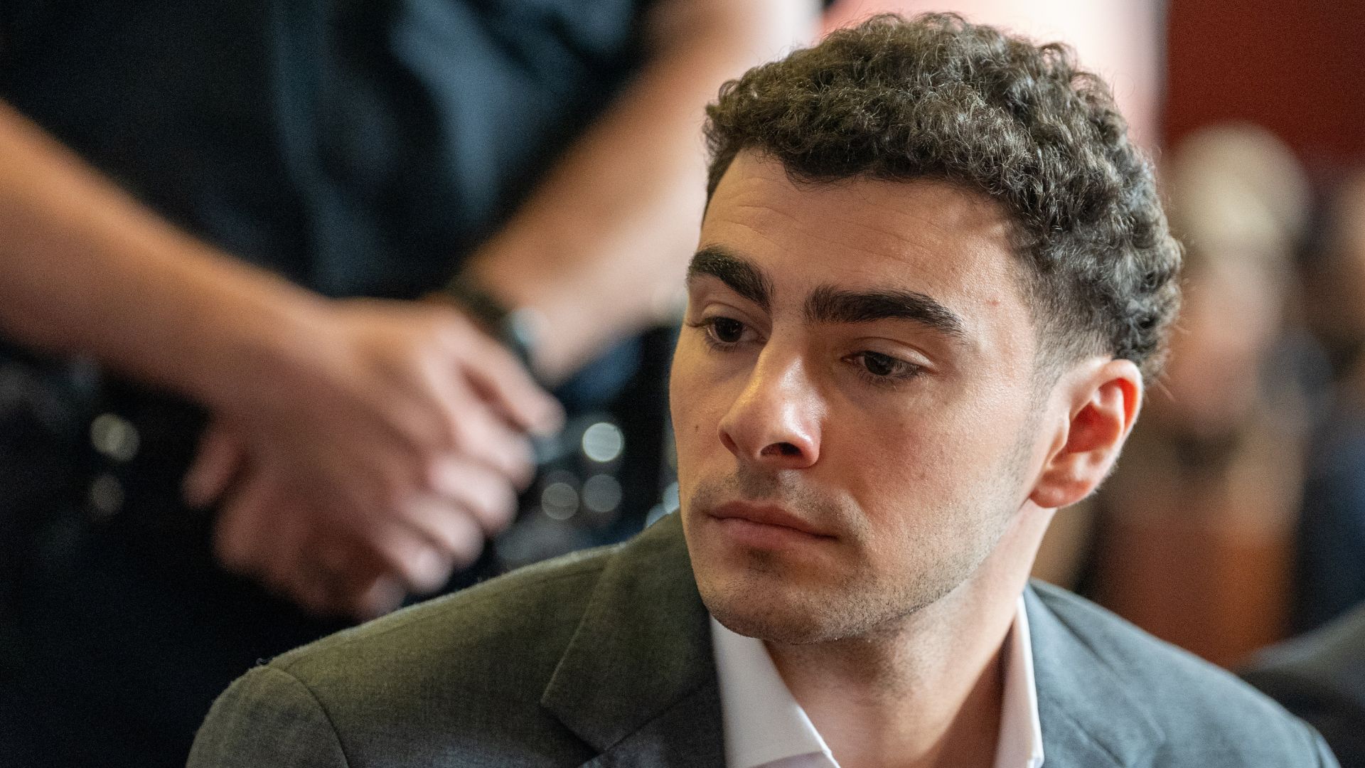 Source-feed image associated with Luigi Mangione court conference renews speculation of potential plea deal in federal case