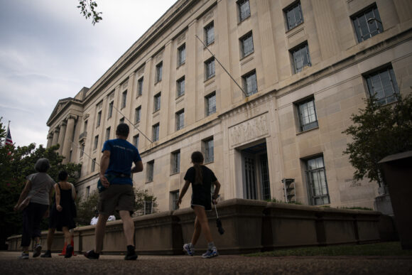 Source-feed image associated with Merger Suits Stall Under DOJ Boss Who Opposes Blocking Deals