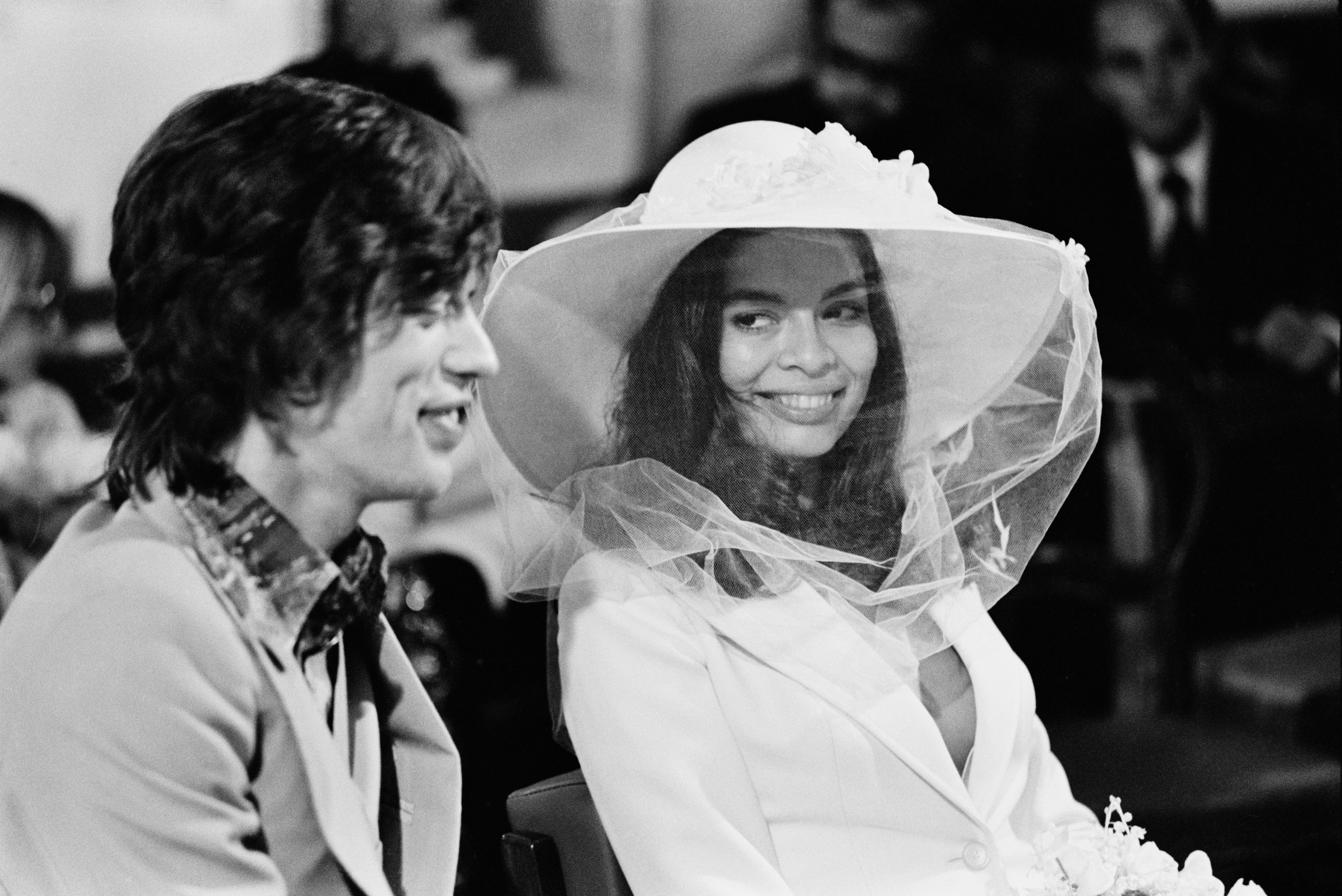 Source-feed image associated with Dua Lipa’s Wedding Skirt Suit Pays Homage to the Original Cool Girl Bride