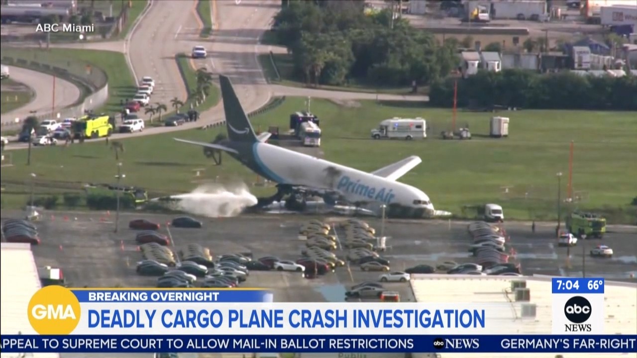 Source-feed image associated with Amazon plane crash: Investigators hunt for what went wrong after cargo plane crashed in Miami, killing at least 5