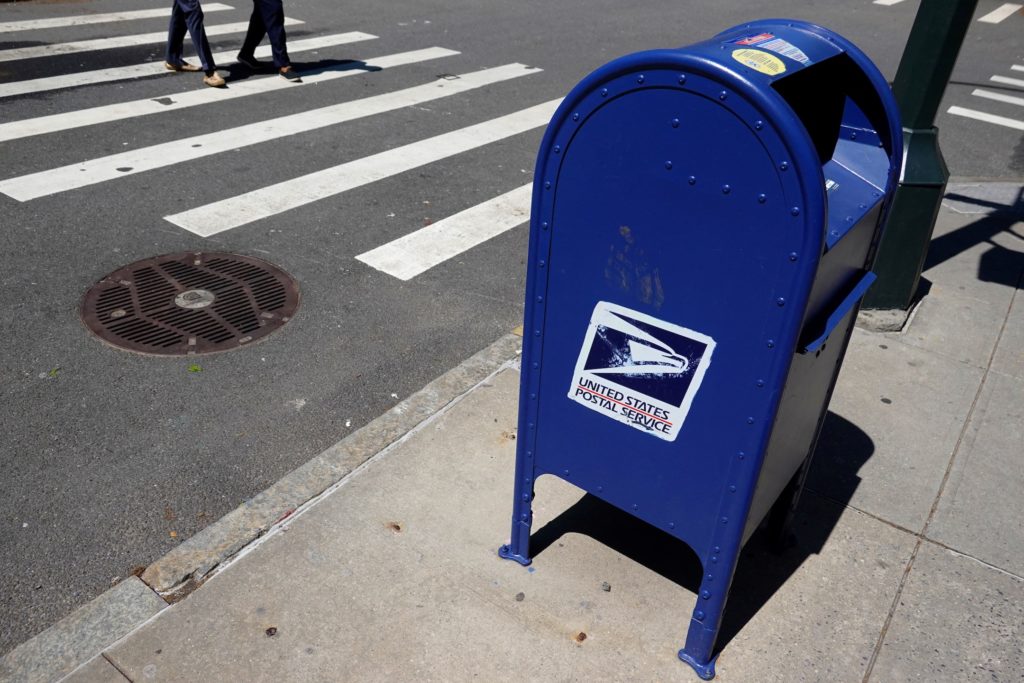 Source-feed image associated with News Wrap: States sue USPS, challenging Trump's order on mail-in voting