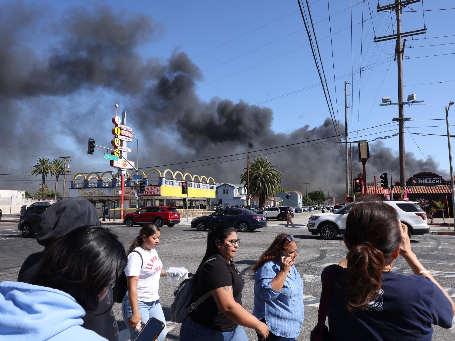 Source-feed image associated with Crews battle massive Boyle Heights warehouse fire and ammonia leak; shelter-in-place order issued