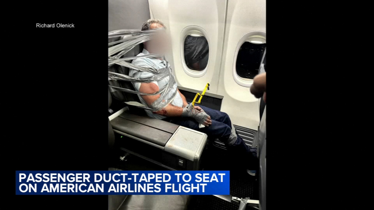 Source-feed image associated with Unruly passenger arrested after being restrained with duct tape during flight