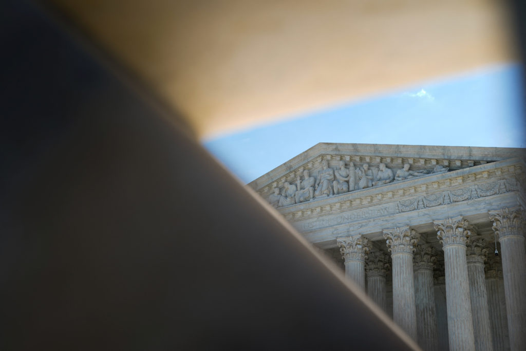 Source-feed image associated with Supreme Court clears way for Trump administration to revive restrictive immigration policy