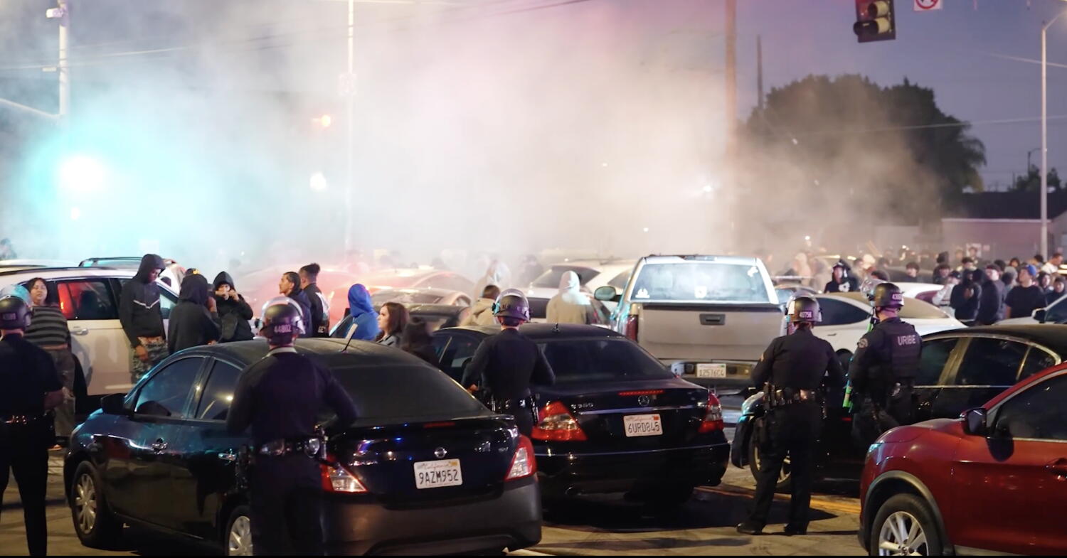 Source-feed image associated with LAPD busts massive street takeover in South Bay, impounding more than 100 cars