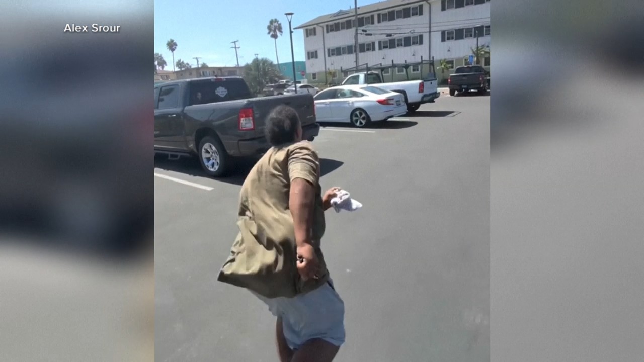 Source-feed image associated with Bystanders chase down suspect after stolen Tesla speeds down boardwalk in San Diego, California