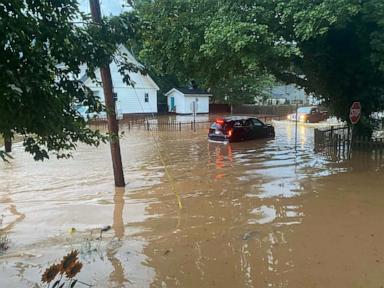 Source-feed image associated with 2 dead in flash floods caused by heavy rain in West Virginia, governor's office says