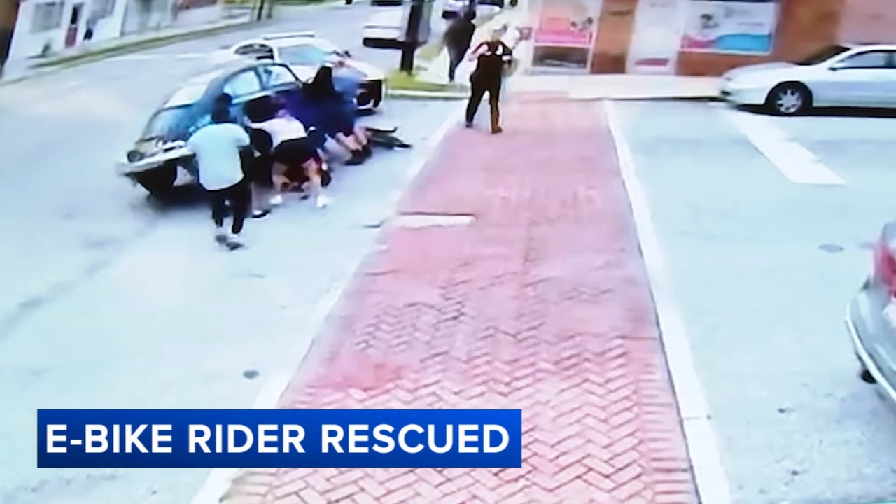Source-feed image associated with Good Samaritans helped lift a car to free a woman trapped underneath after a horrific e-bike crash in Prospect Park, Pennsylvania