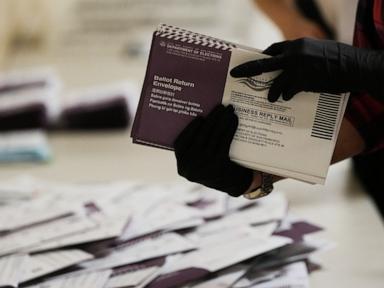 Source-feed image associated with Federal court hears arguments over efforts to halt Trump's mail-in executive order