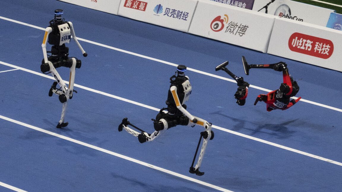 Source-feed image associated with World humanoid robot games show runners breaking records, bursting into flames