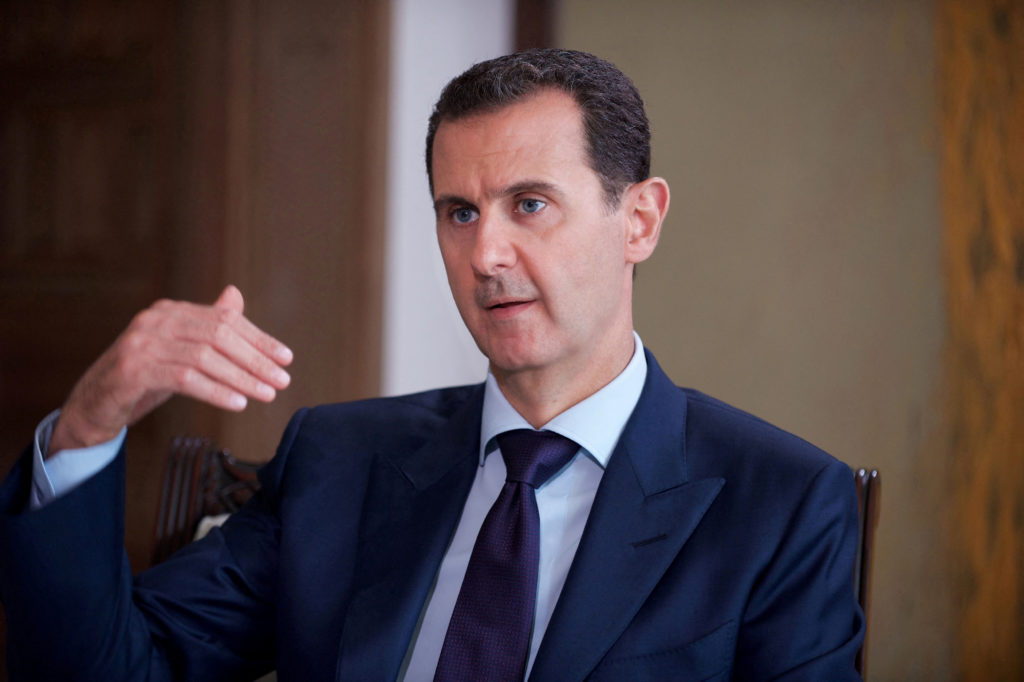 Source-feed image associated with News Wrap: Syria sentences Bashar al-Assad to death in absentia