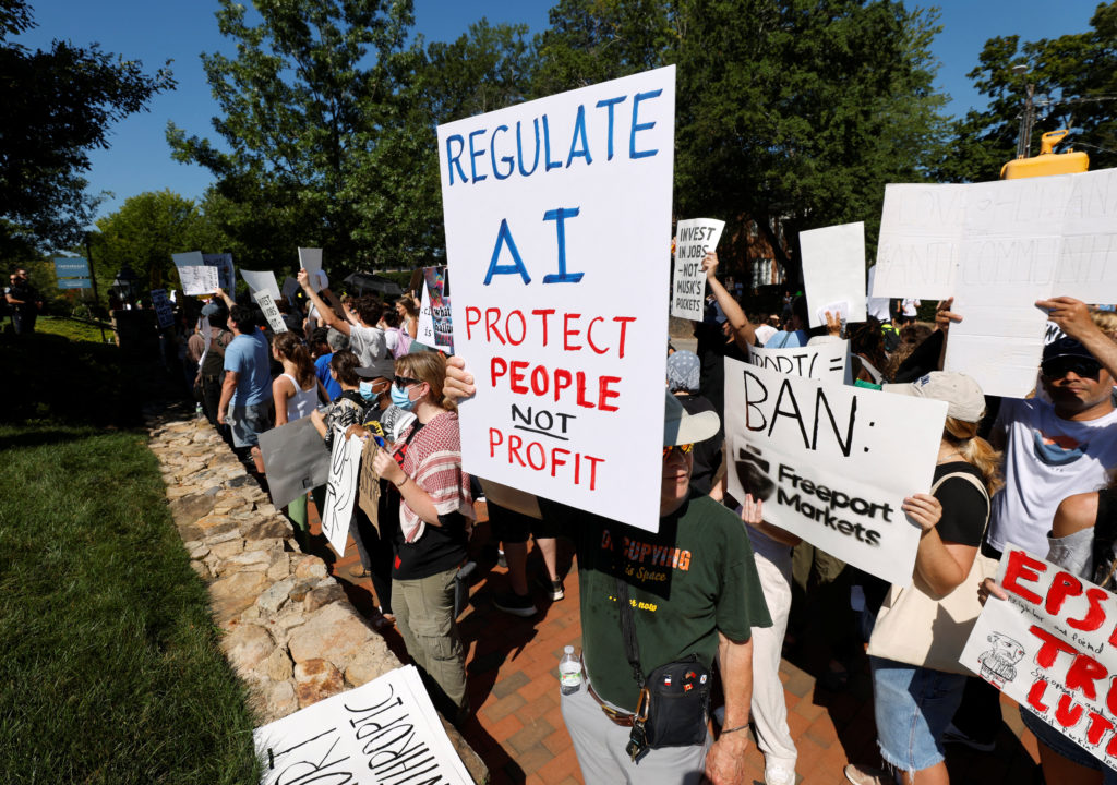 Source-feed image associated with What to know about recent dire AI predictions and calls for safeguards