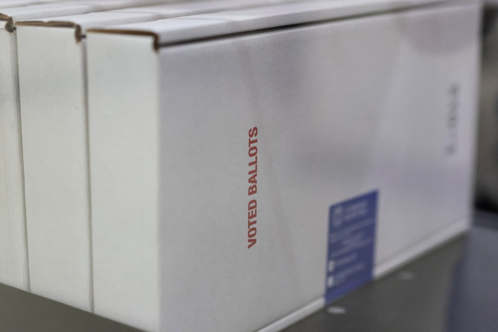 Source-feed image associated with Federal judge extends block on Trump order seeking to limit mail voting in the midterms
