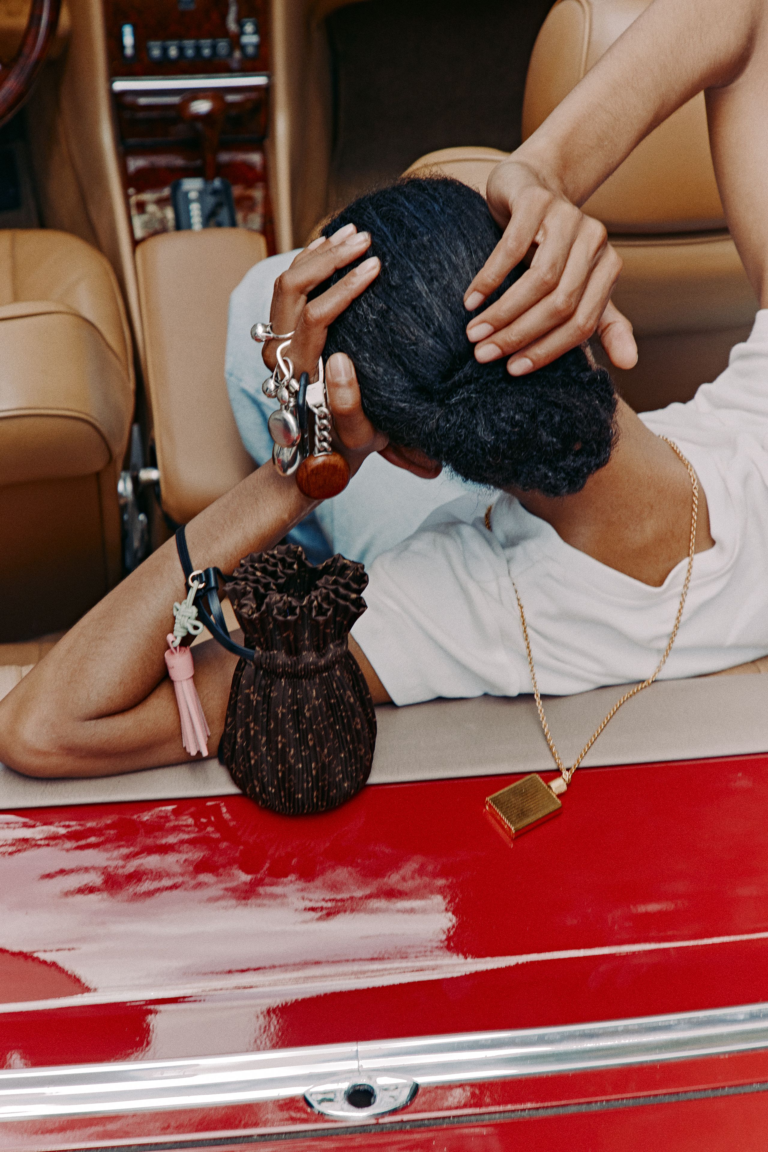 Source-feed image associated with The Newest Way to Wear Your Perfume Is as an Accessory