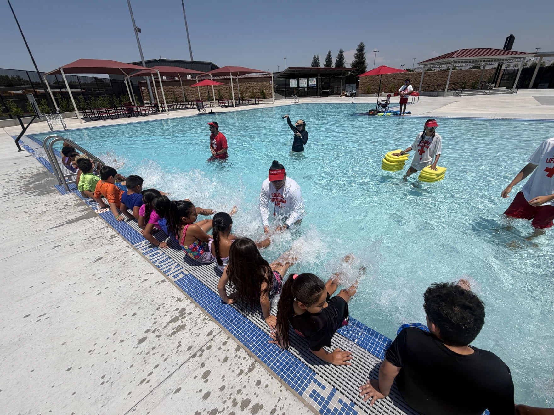 Source-feed image associated with Kids Learning to Swim at Community Pool in Central Valley