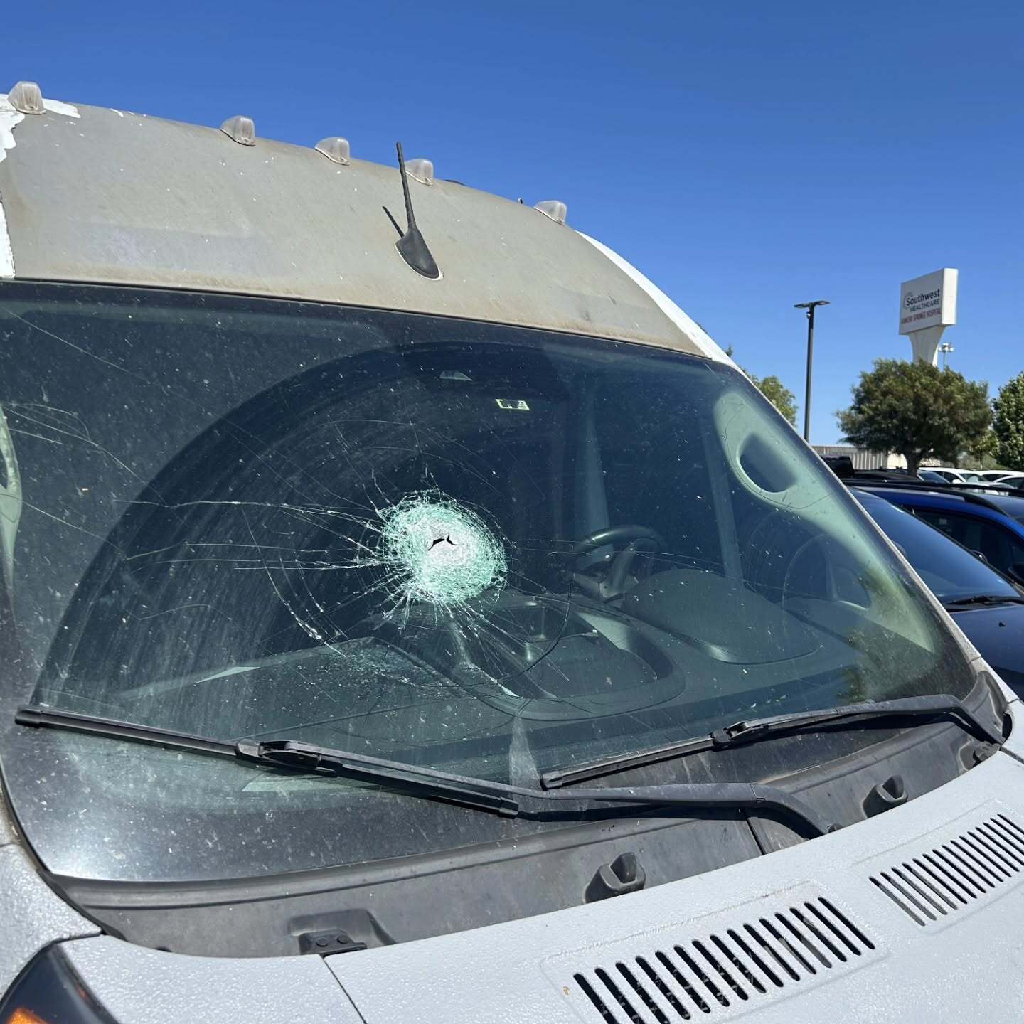 Source-feed image associated with Metal pole pierces windshield, hits pregnant driver after falling off truck on SoCal freeway