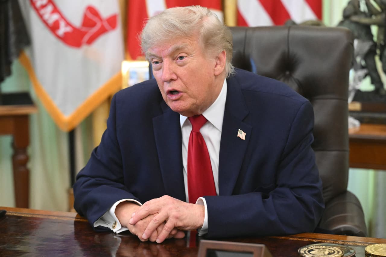 Source-feed image associated with Trump rings Wall Street opening bells and says the stock market ‘is going to go through the roof’