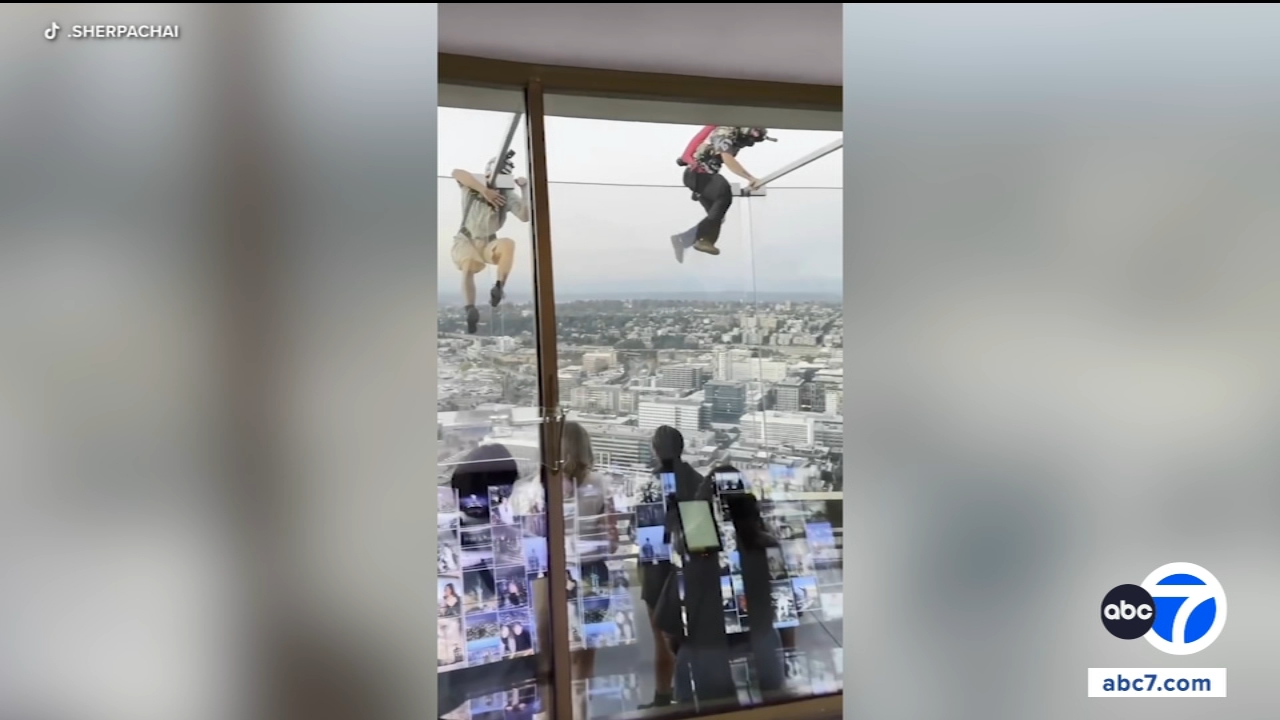Source-feed image associated with Seattle police are searching for two men who parachuted from the Space Needle