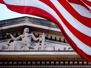 Source-feed image associated with US journalist pleads guilty to acting as an illegal agent for China
