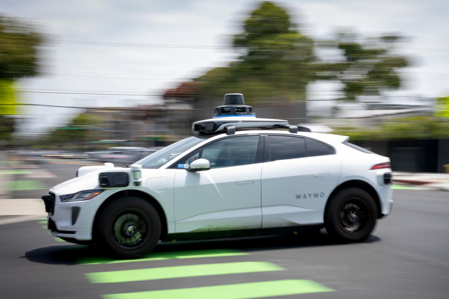 Source-feed image associated with Shirtless man arrested after police say he climbed, vandalized a Waymo in East Hollywood