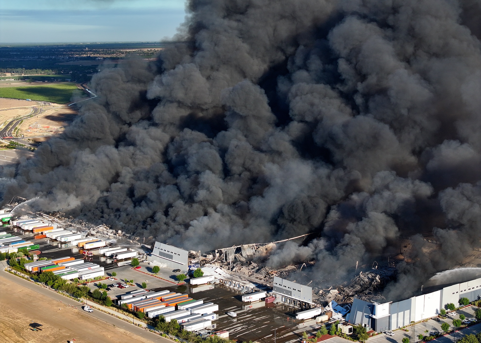 Source-feed image associated with ‘A Perfect Storm’: Massive Tracy Medical Supply Warehouse Fire Still Burning