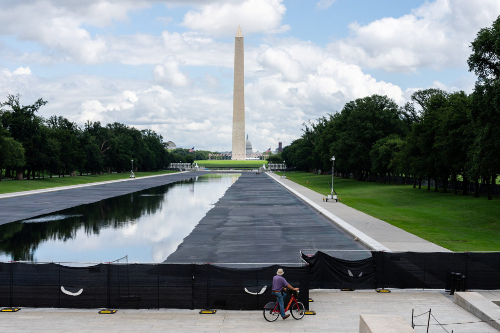 Source-feed image associated with Trump pushes ahead on false claims Reflecting Pool was vandalized