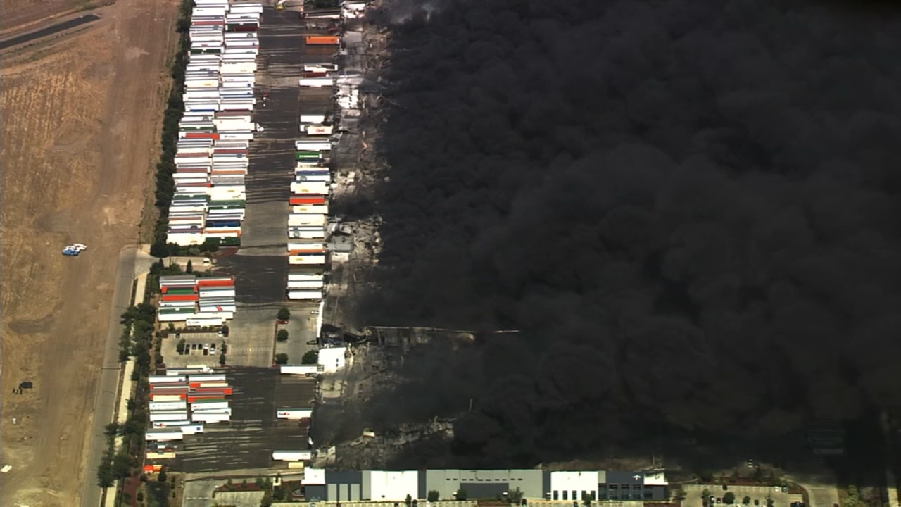 Source-feed image associated with Crews respond to massive warehouse fire in Tracy; public asked to avoid the area