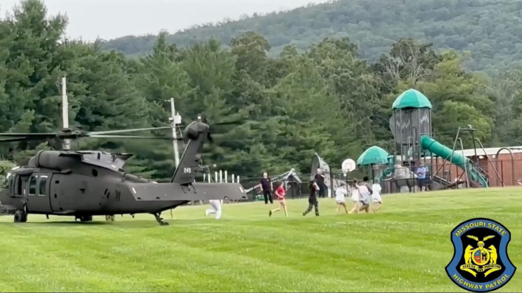 Source-feed image associated with More than 200 people at a summer camp helicoptered to safety as Missouri faces flooding