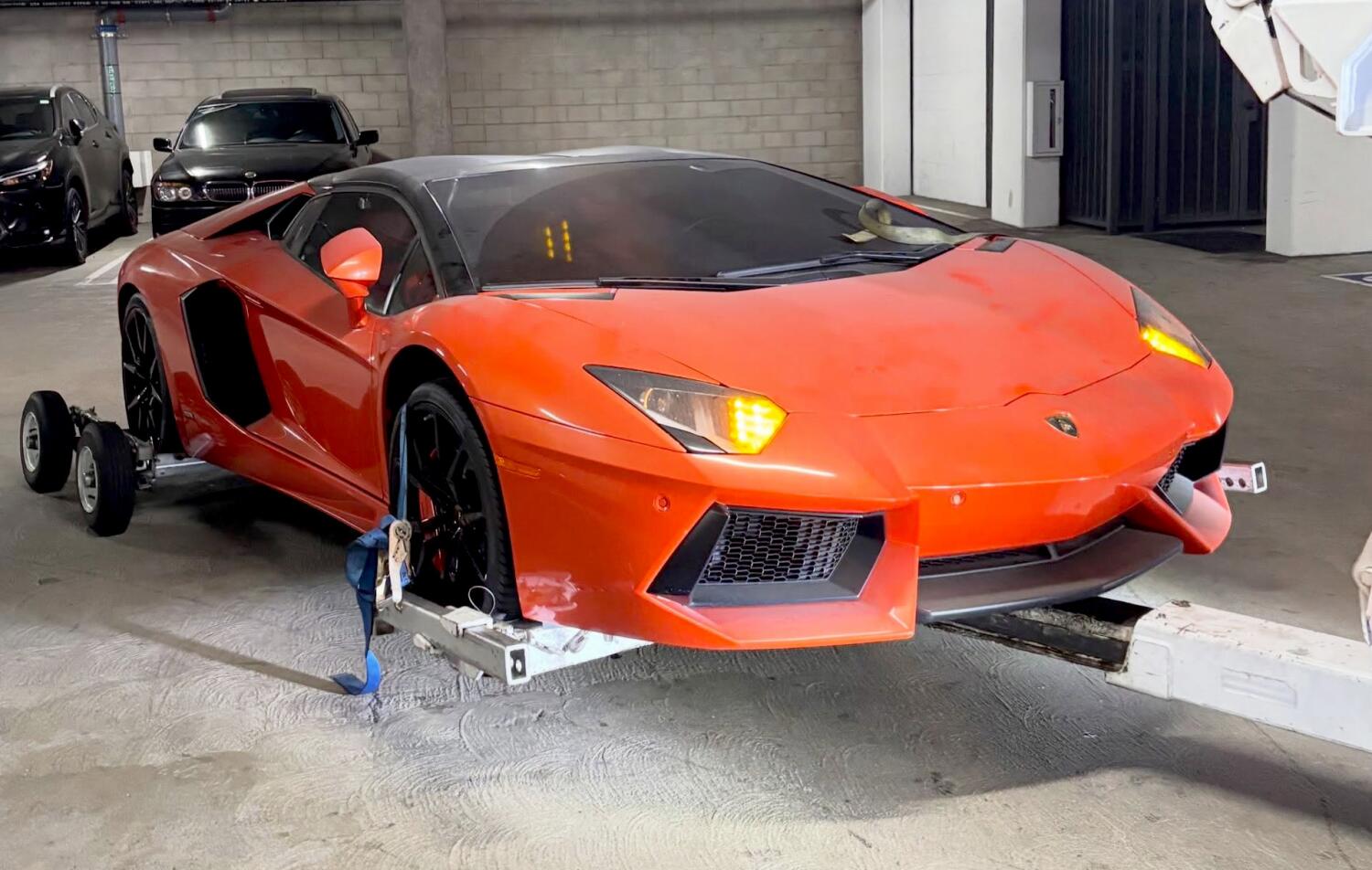 Source-feed image associated with Luxury vehicles including Lamborghini, Porsche and BMW seized in SoCal theft bust