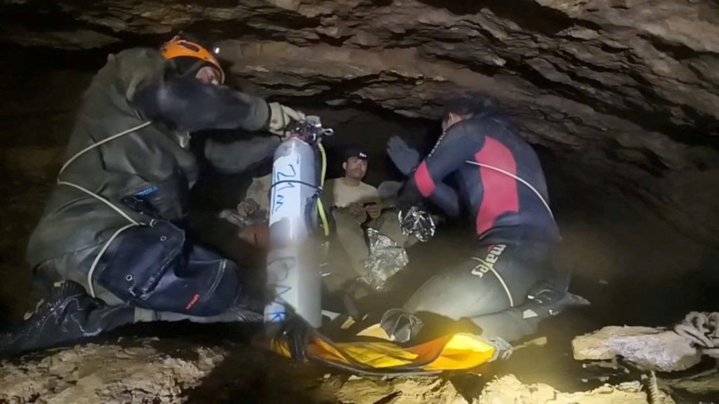 Source-feed image associated with Four men rescued from flooded Laos cave as search continues for 2 others