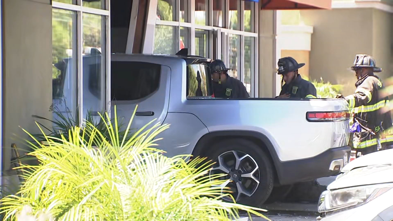 Source-feed image associated with 1 person injured after pickup truck crashes into San Jose business, police say