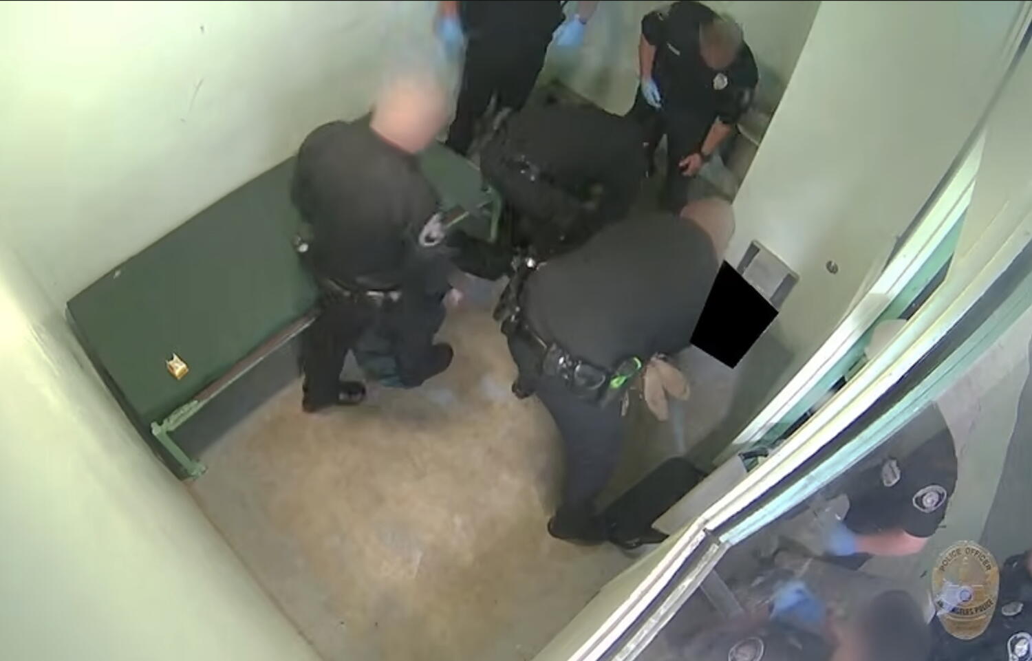 Source-feed image associated with LAPD releases video of officers beating handcuffed jail inmate who later died