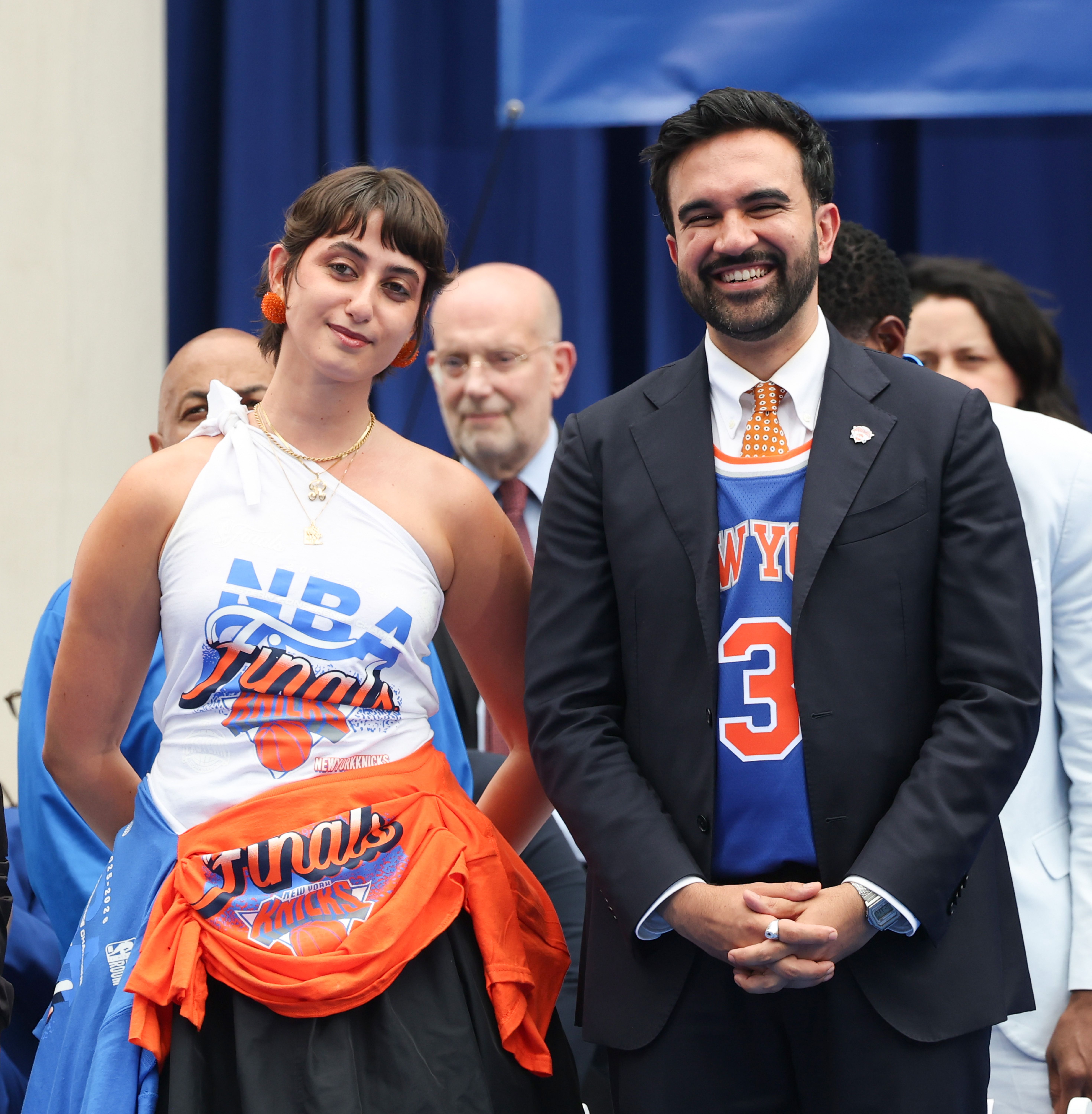 Source-feed image associated with Exclusive: Rama Duwaji Sports Cult NYC Label at New York Knicks Championship Parade