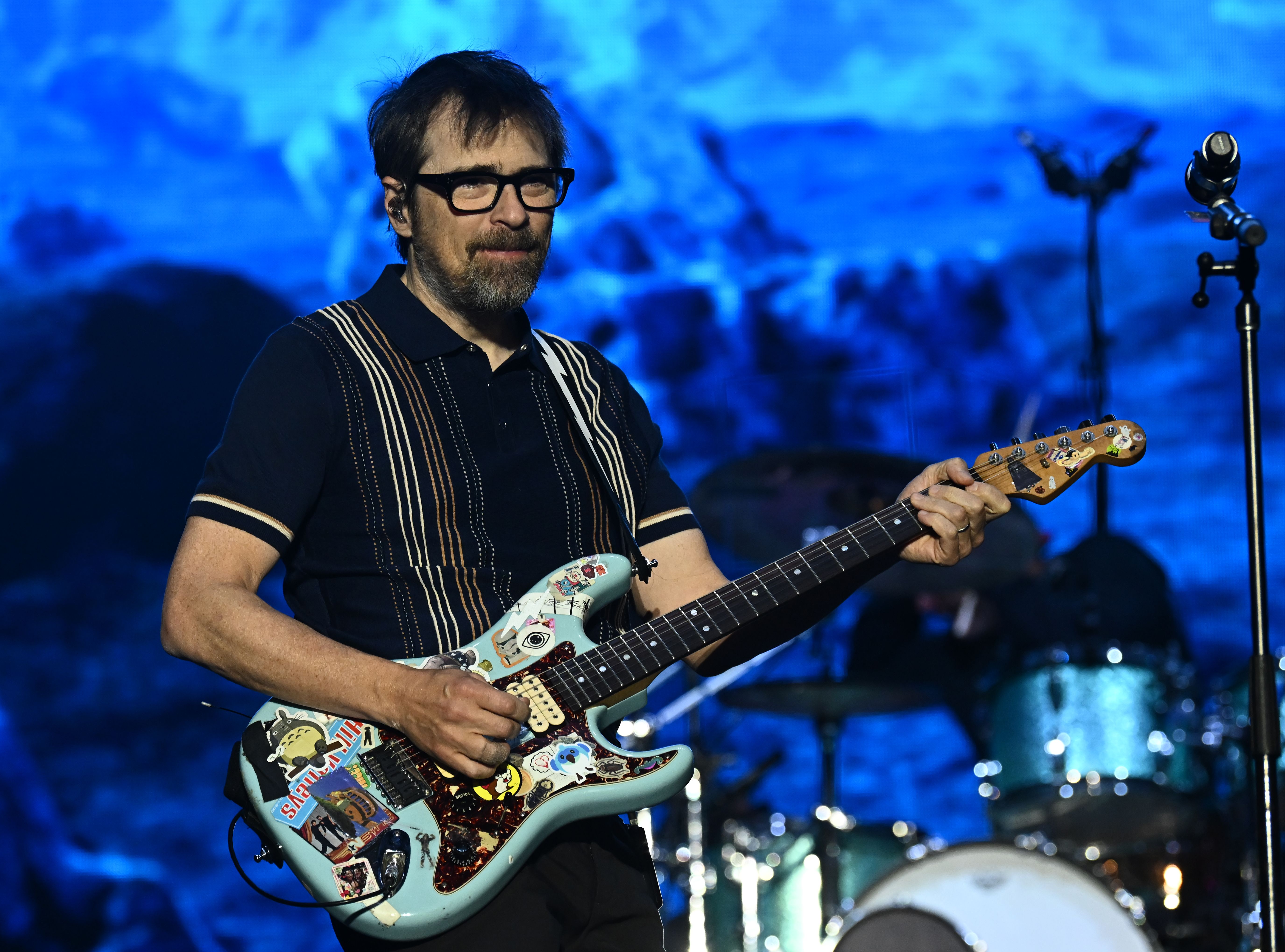 Source-feed image associated with Listen to Rivers Cuomo Cover Whitney Houston, Outkast, Dolly Parton, and More